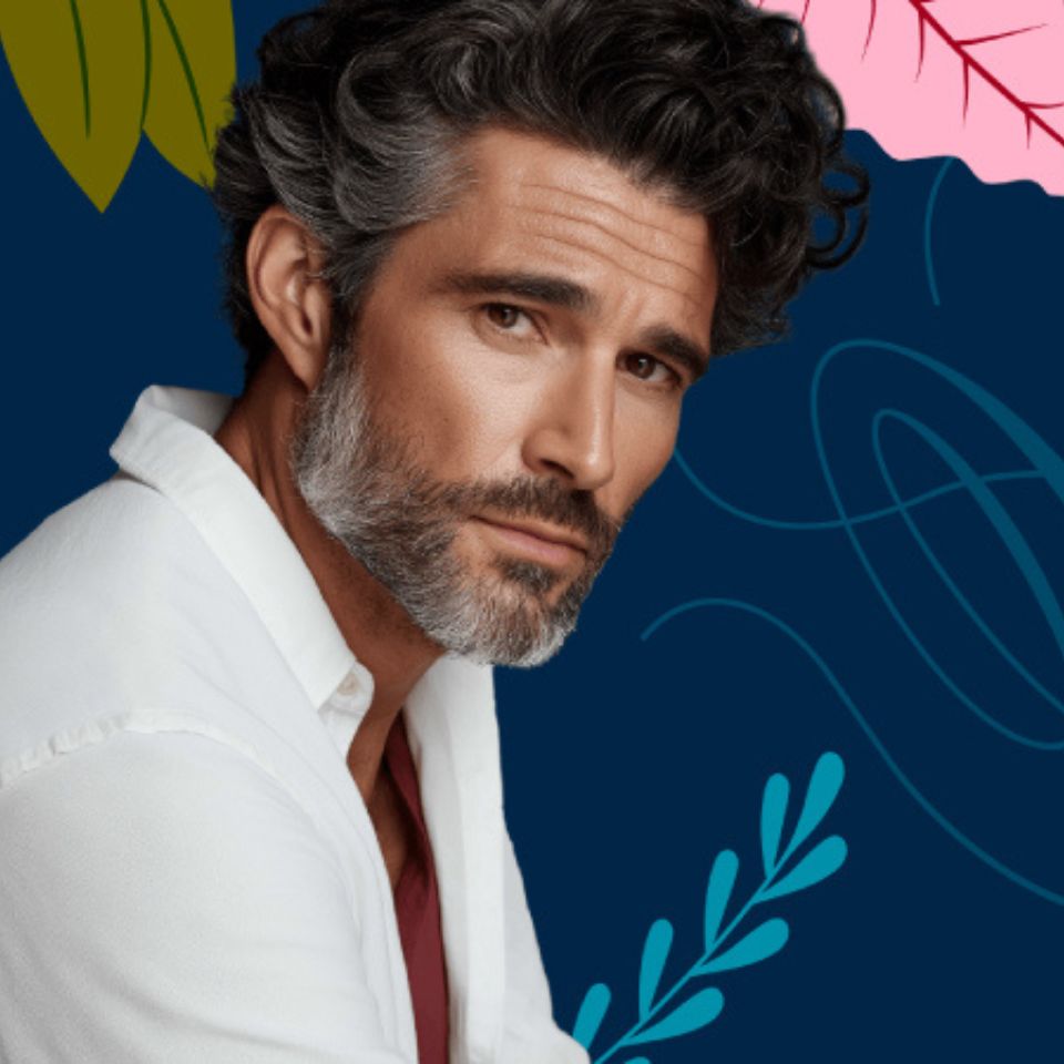 This appears to be a stylized portrait of a man with dark curly hair and a salt-and-pepper beard, wearing a white shirt against a colorful illustrated background.

If you want, I can also help with:
- a more detailed description,
- identifying the style/genre,
- or generating alt text.