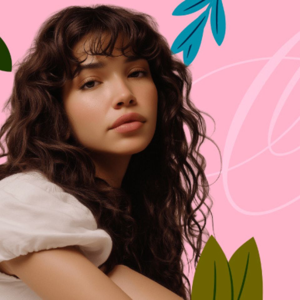 Portrait of a woman with curly hair against a pink background with leaf shapes