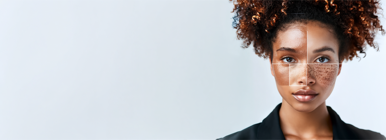 The image shows a person with curly hair wearing a black blazer. The background is plain and light-colored, possibly white or light gray. The person's face is blurred, so no facial details are visible. The overall composition is professional and clean. If you need any specific analysis or information about the image, please let me know!