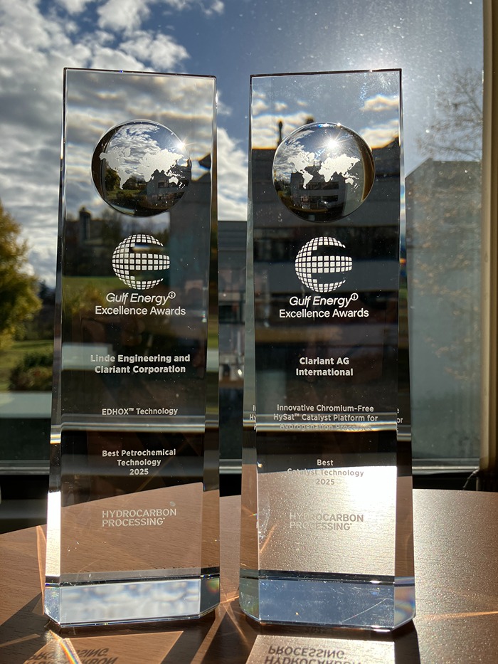 The image shows two clear glass awards with the following details:

**Left Award:**
- Title: Gulf Energy® Excellence Awards
- Recipient: Linde Engineering and Clariant Corporation
- Technology: EDHOX™ Technology
- Category: Best Petrochemical Technology 2025
- Issuer: Hydrocarbon Processing®

**Right Award:**
- Title: Gulf Energy® Excellence Awards
- Recipient: Clariant AG International
- Technology: Innovative Chromium-Free HySat™ Catalyst Platform for Hydrocarbon Processing
- Category: Best Catalyst Technology 2025
- Issuer: Hydrocarbon Processing®

Both awards are placed on a wooden surface with a window and sky in the background.